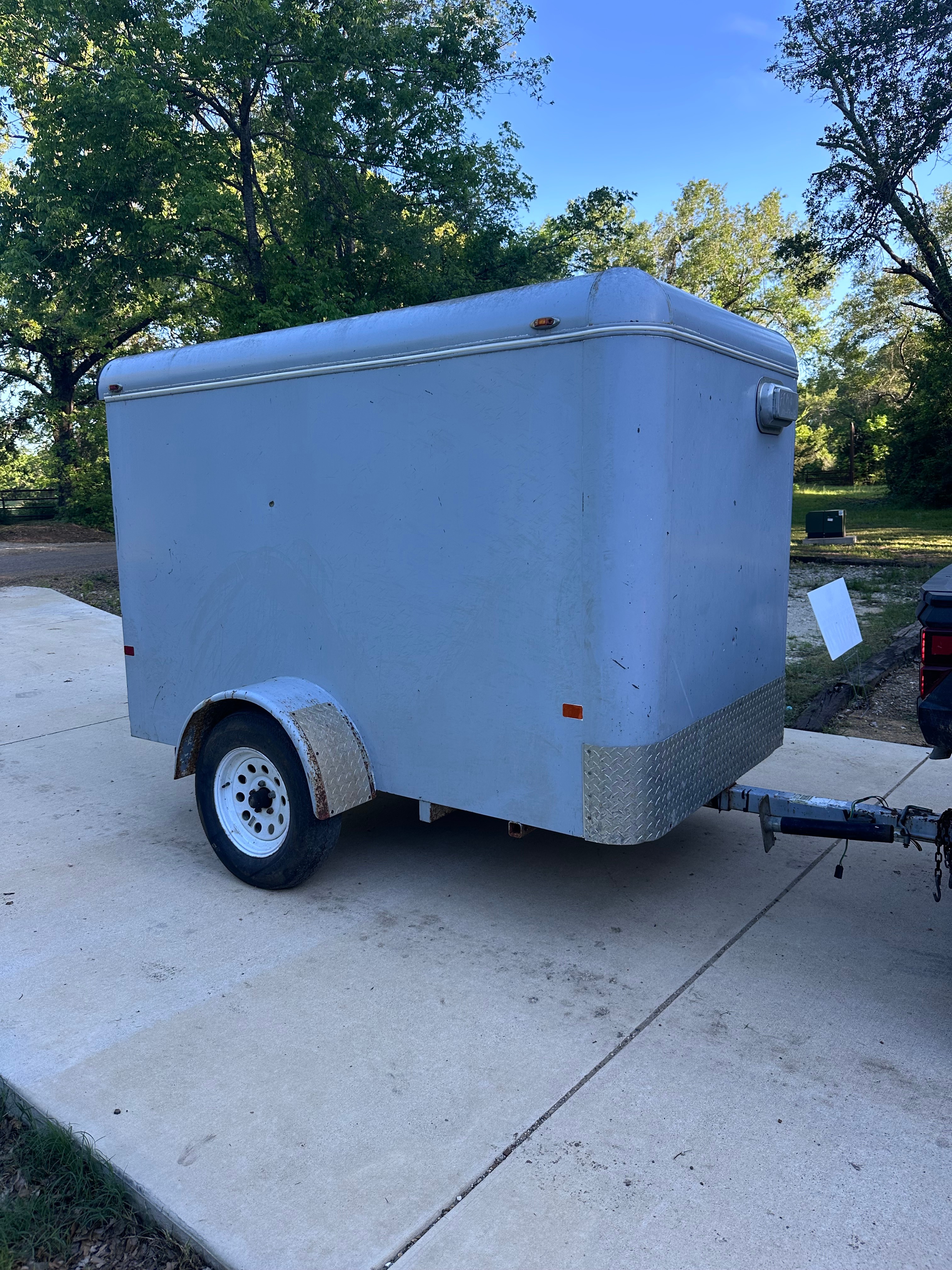 8ft enclosed cargo trailer with rear swing door for secure weatherproof rentals in Kemp, TX