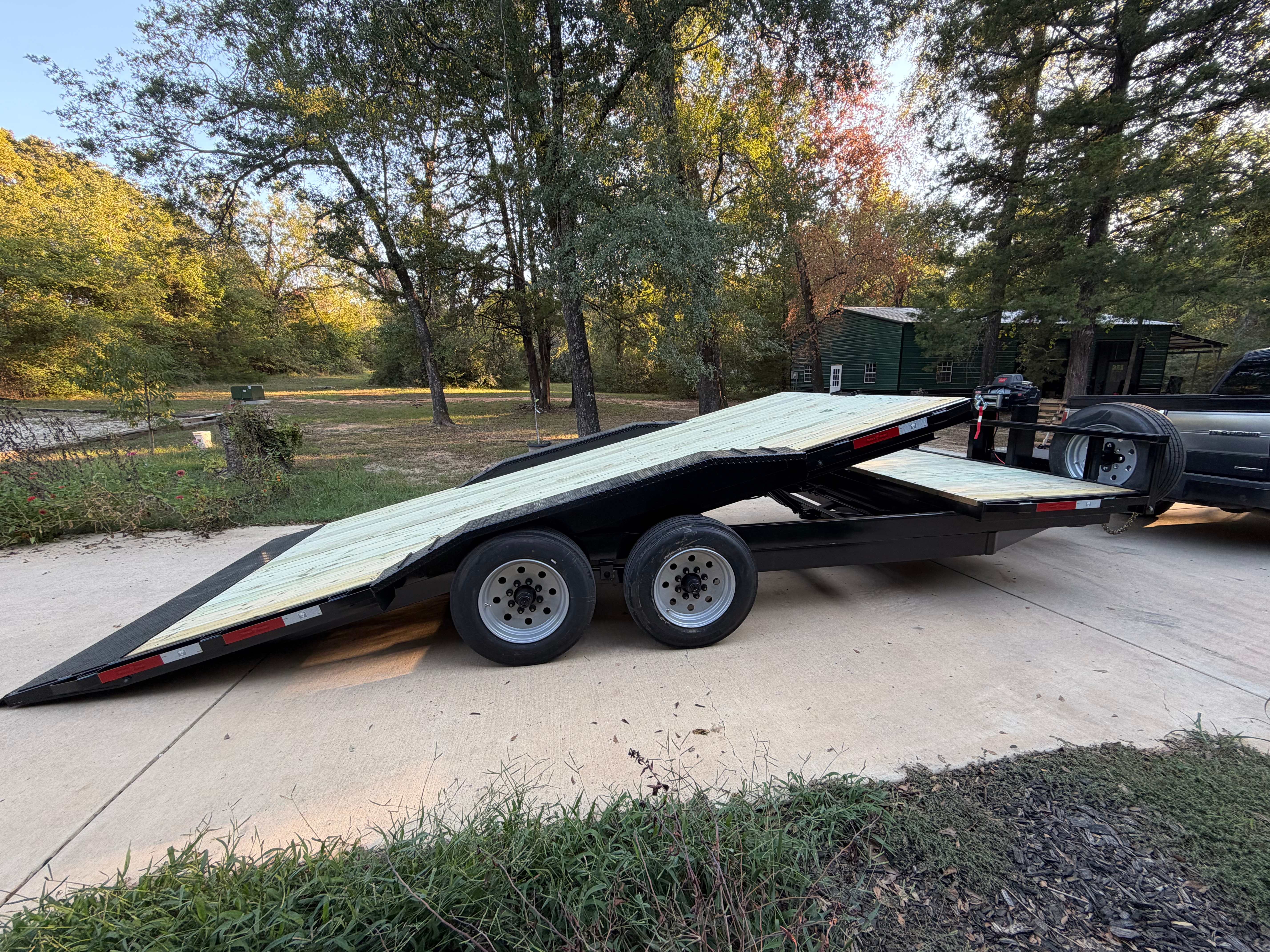 Texas Pride 14K 21 foot tilt deck trailer for rent in Kemp TX with deck tilted for loading